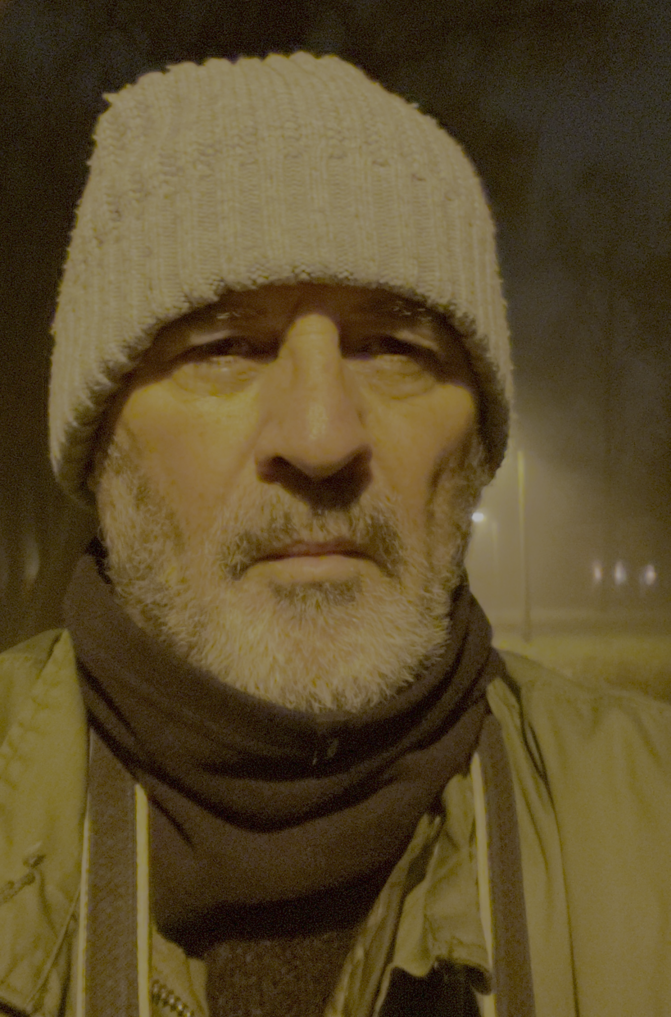 Anthony Forrest wearing a cream knitted hat and scarf
