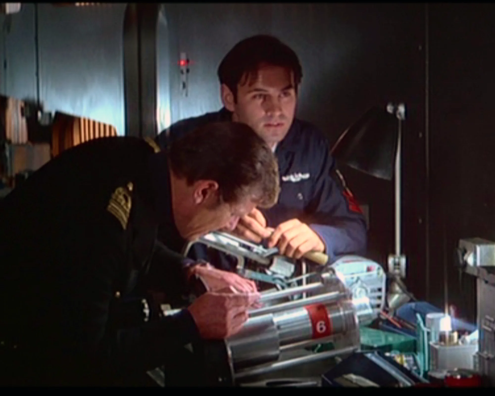 Anthony Forrest with Roger Moore working on a device in The Spy Who Loved Me