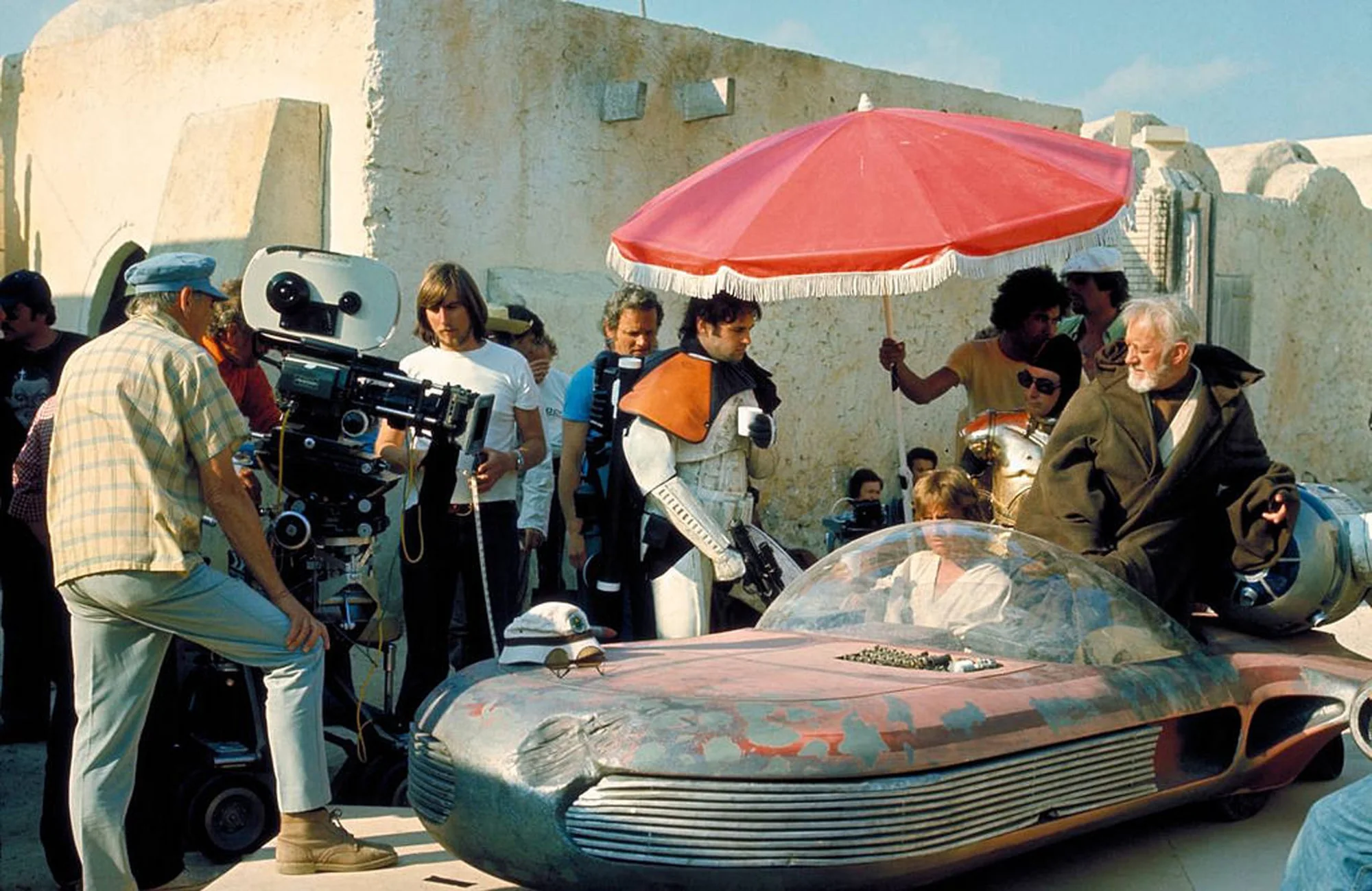 Anthony Forrest without a helmet, wearing an orange shoulder piece on the Star Wars set